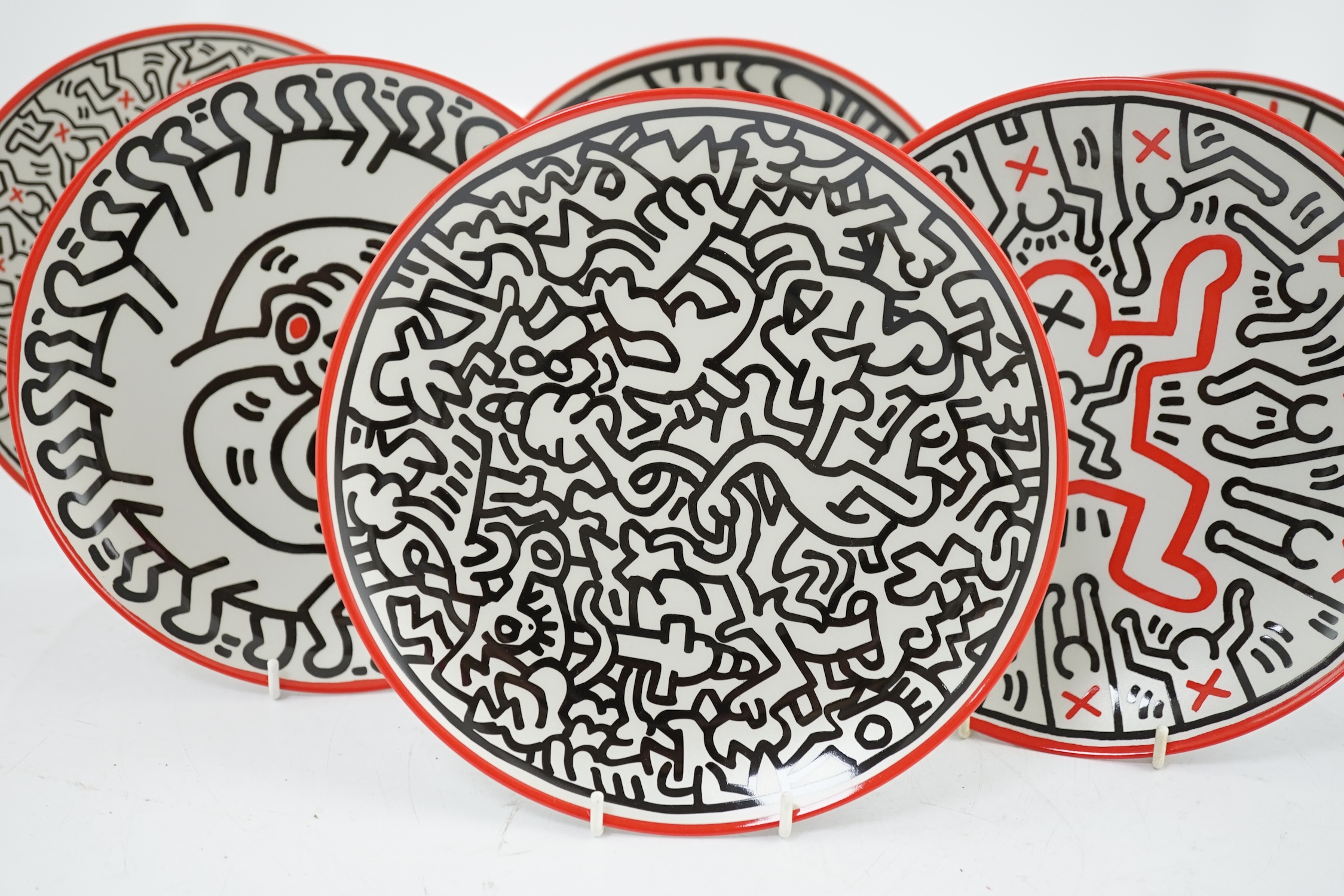 Keith Haring (American, 1958-1990) designs, a set of six Ligne Blanche, Limoges porcelain plates